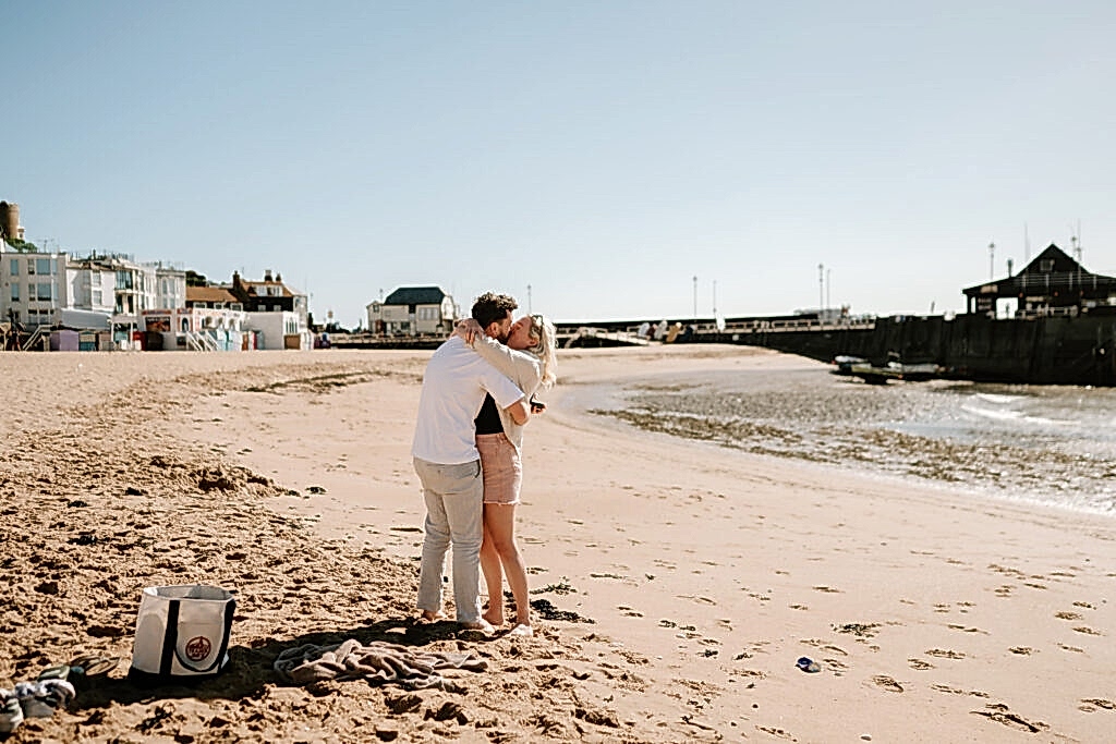 Couple hugging on a sandy beach